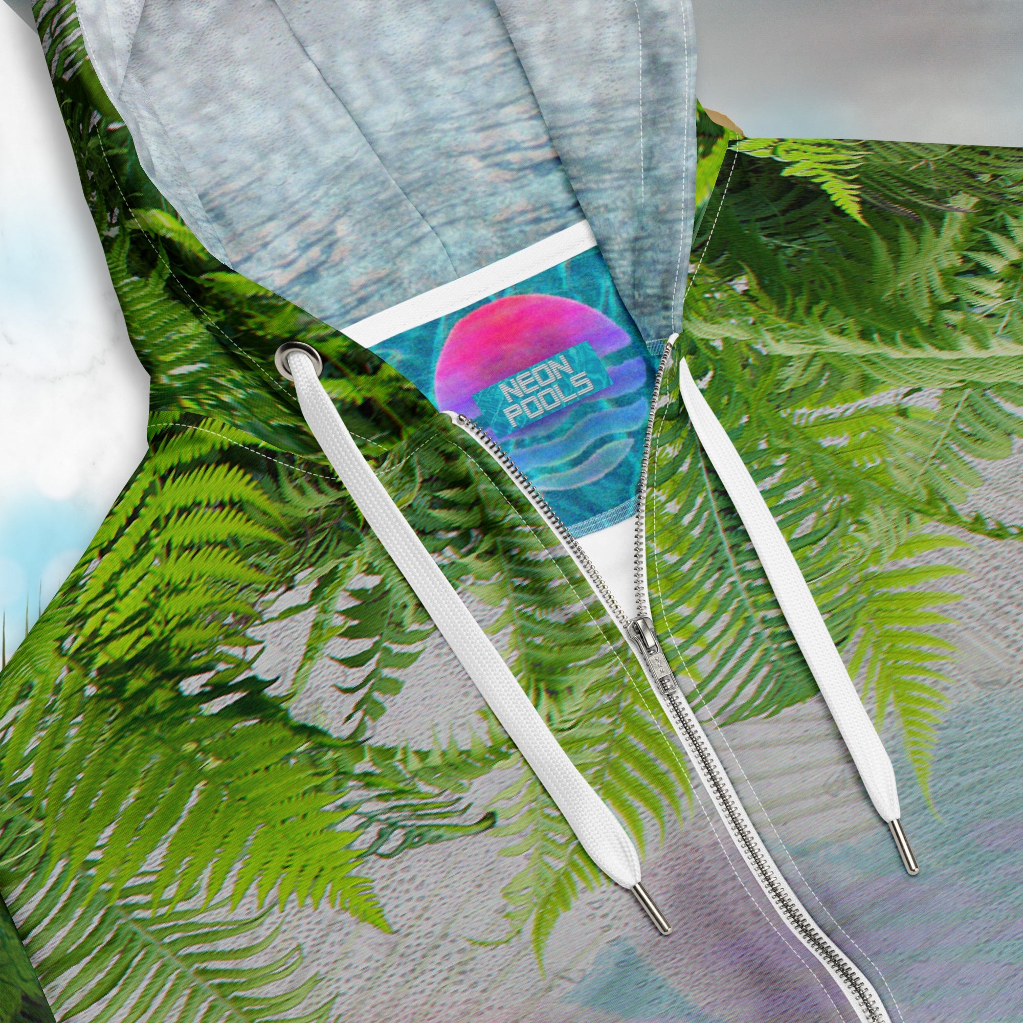 Closeup of neck line and Neon Pools iner logo patch and insignia ohite marble vaporwave themed hoodie with fern leaves tropical plants digital water rain drop effects and retro abstract patterns with greco roman bust with neon pools logo for eyes palm trees and leaning towers on back gold bands on sleeves