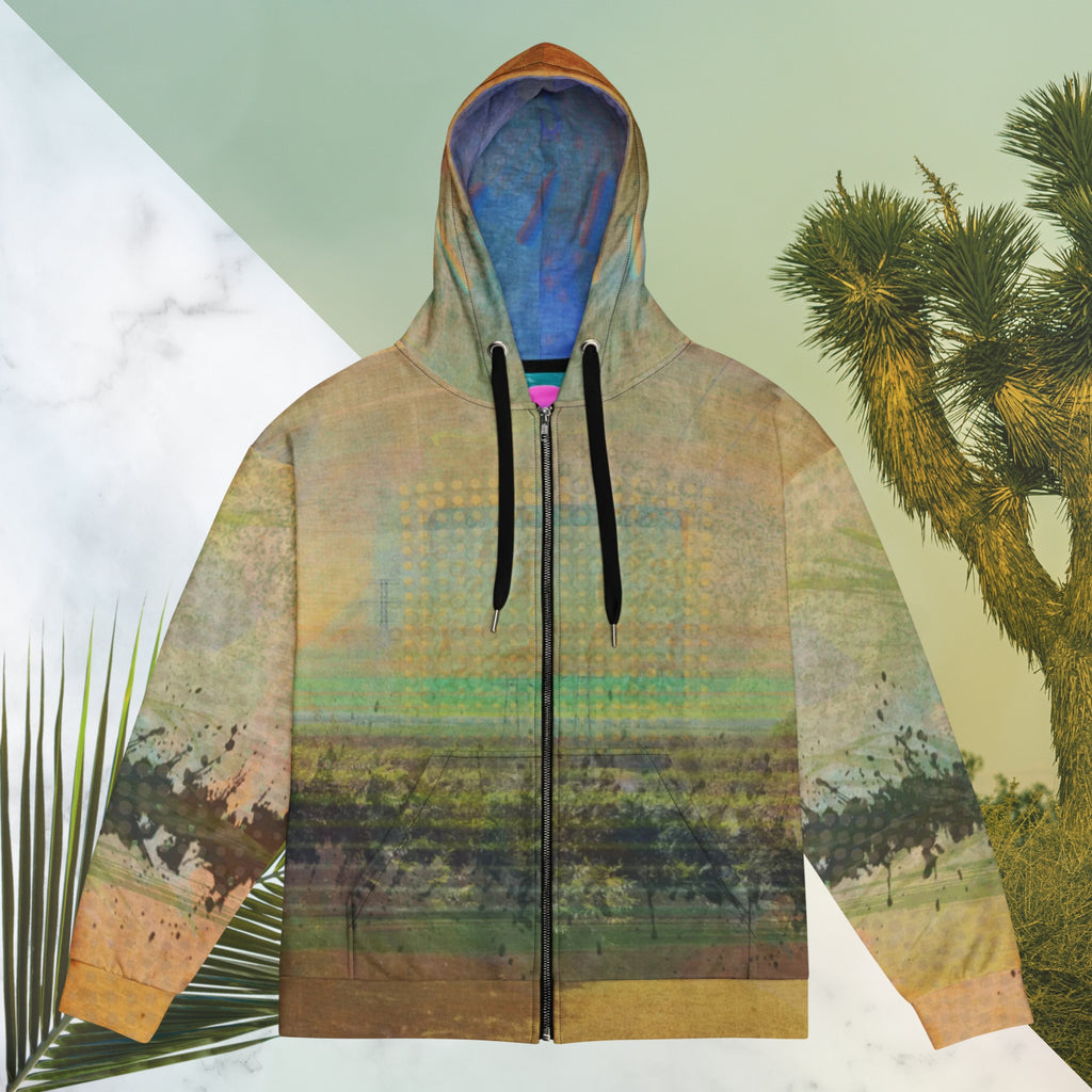 Multicolored primarily orange all over print zip hoodie depicting a long distance view of trees and power lines with vintage 90s style distortion abstract orange dot grids line patterns in shades of green and yellow black ink splotch lines and the background appearing as a painted canvas jungle plants and graphic lines overlayed on the sleeves