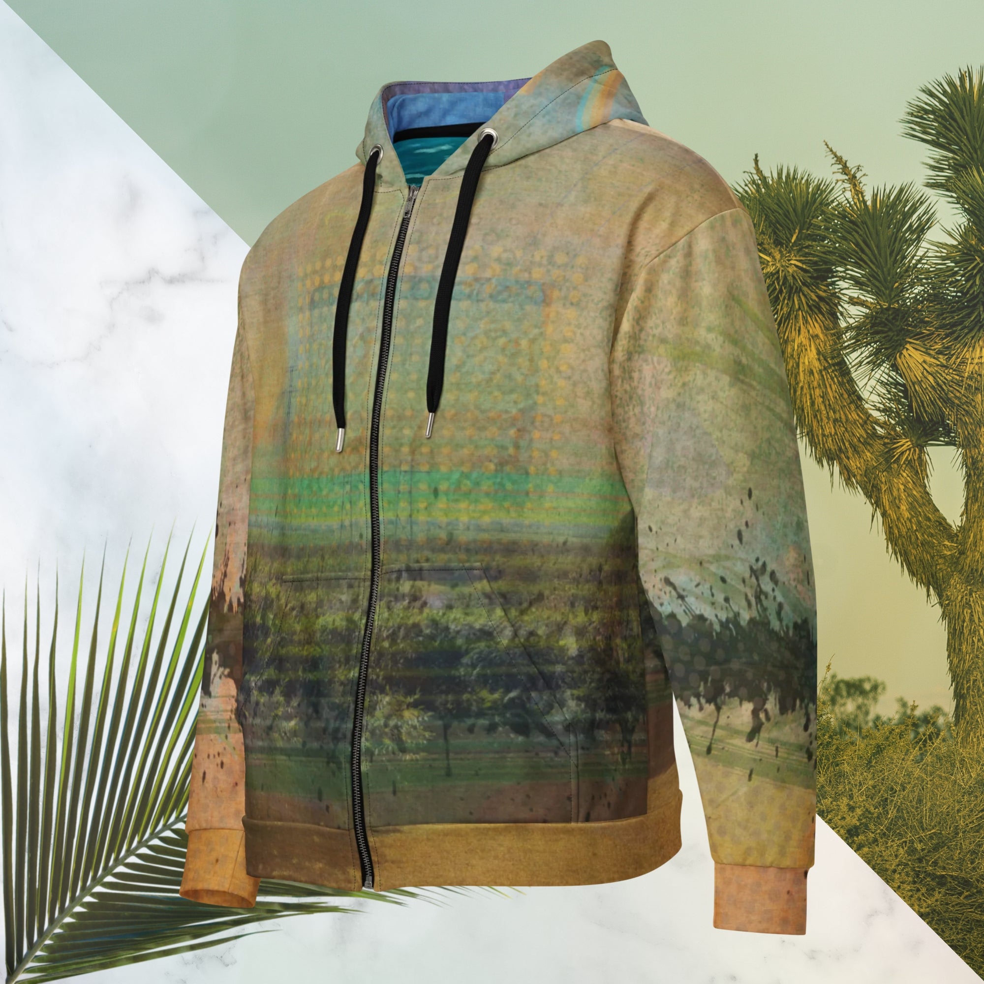 Multicolored primarily orange all over print zip hoodie depicting a long distance view of trees and power lines with vintage 90s style distortion abstract orange dot grids line patterns in shades of green and yellow black ink splotch lines and the background appearing as a painted canvas jungle plants and graphic lines overlayed on the sleeves