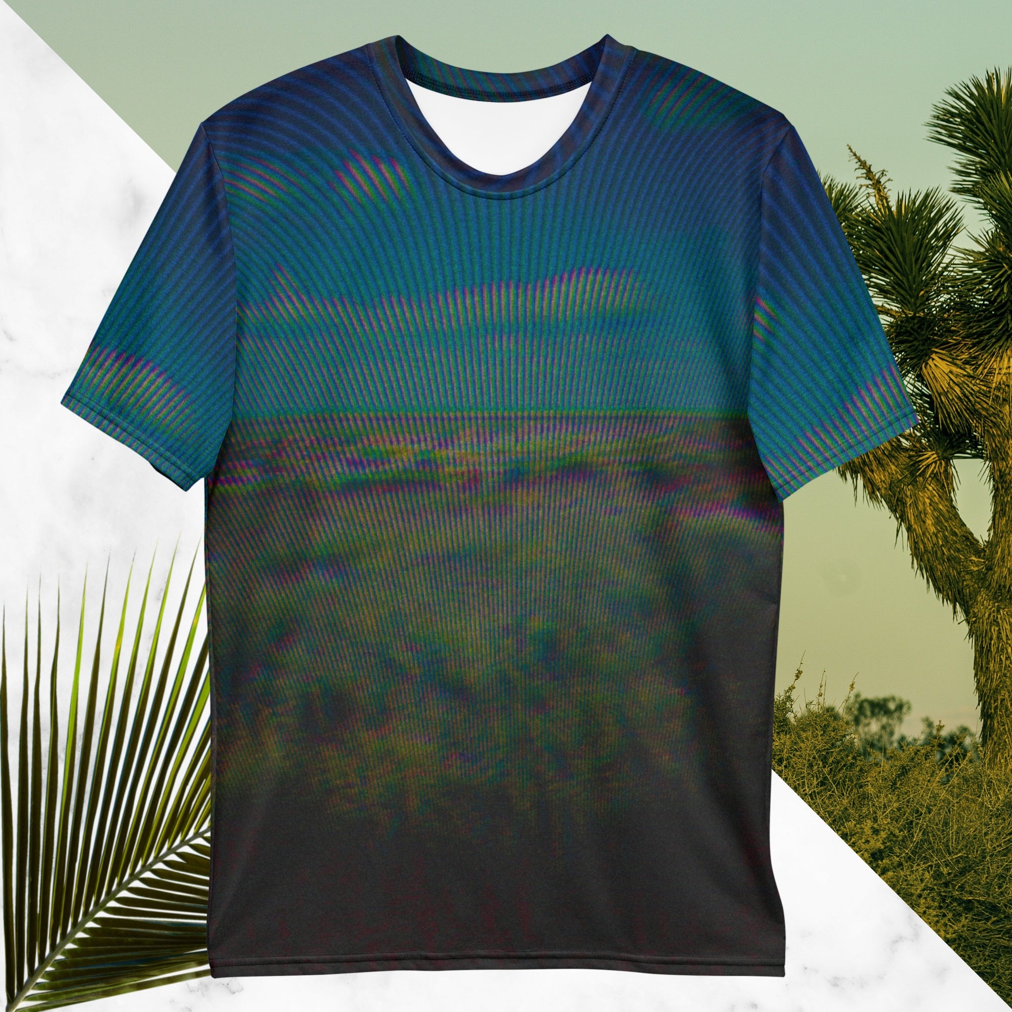 Full color all over print graphic tee shirt with image of a desert and green desert plants and blue sky with clouds above the horizon overlayed with rgb distortion and psychedelic lines graphics fanning outward towards the top