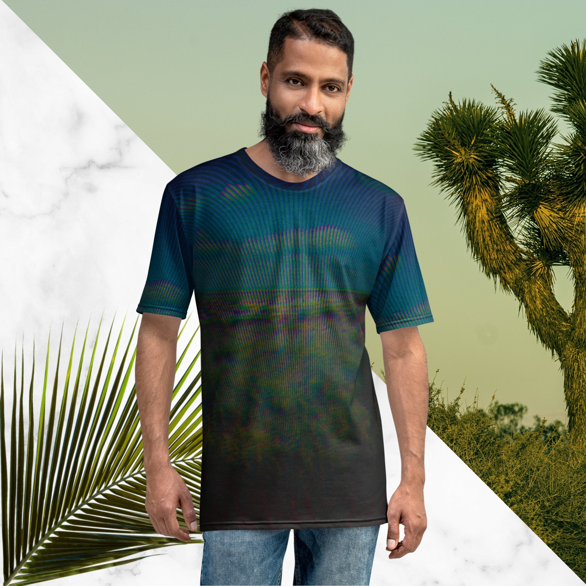 Full color all over print graphic tee shirt with image of a desert and green desert plants and blue sky with clouds above the horizon overlayed with rgb distortion and psychedelic lines graphics fanning outward towards the top