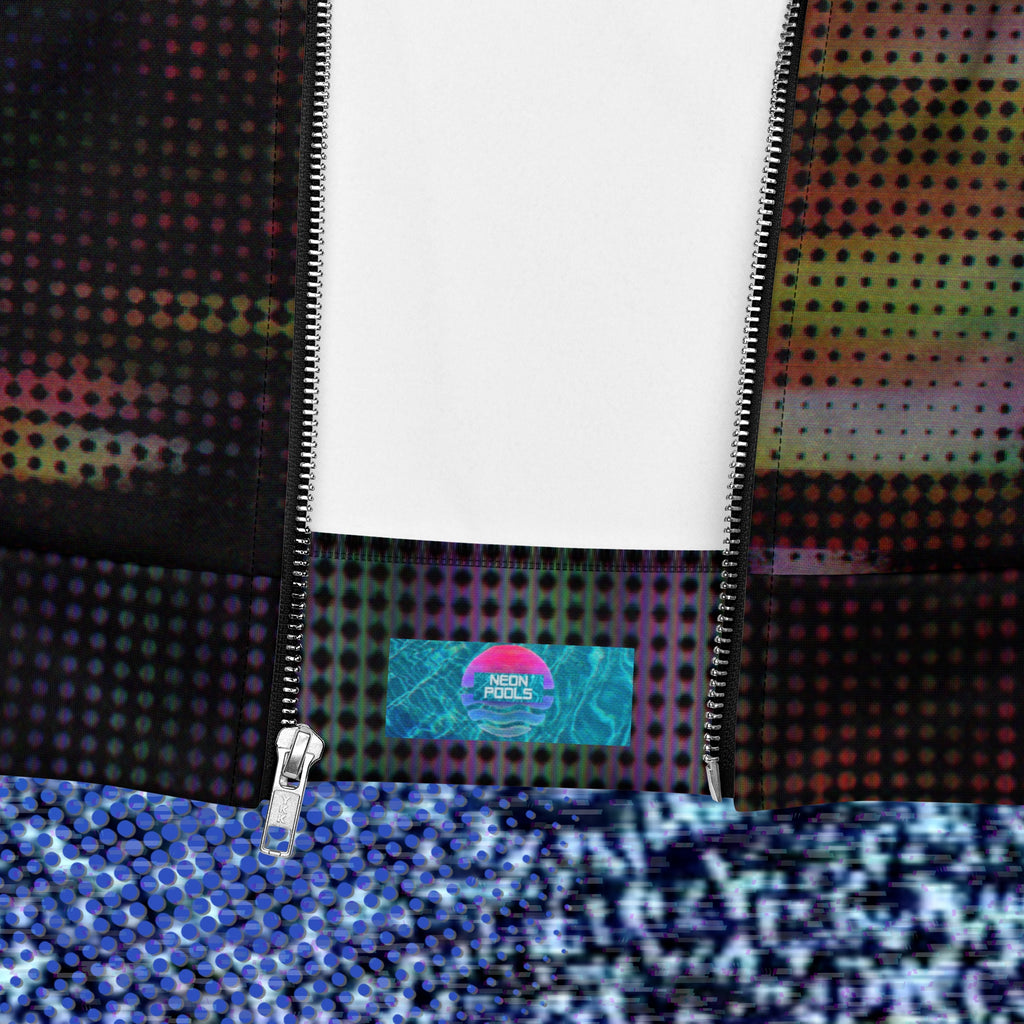 Closeup of Neon Pools logo and insignia on rear lower inner fold on primarily black full color all over print bomber jacket with a distorted and glitched aurora borealis sunset behind warped pine trees overlayed with black dots forming retro television scan lines and vibrant iridescent shades of color darkening towards the top