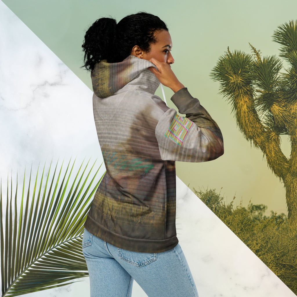 Multicolored all over print zip hoodie with full color 90s photo of sun setting through trees with grass in foreground overlayed with retro tv distortion and scan lines with grainy vhs effect transparent whit bars graphic in rhombus shape on left sleeve the numbers 1996 on right sleeve and left side of hood in retro 90s memphis font and retro jazz squiggle on back blending with colors