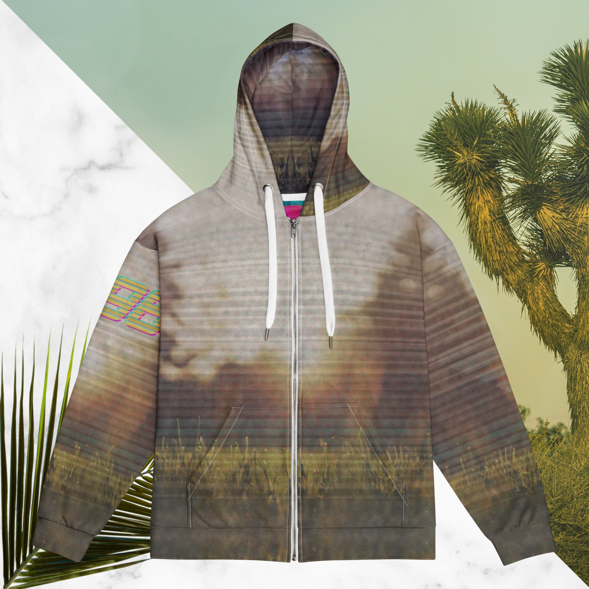 Multicolored all over print zip hoodie with full color 90s photo of sun setting through trees with grass in foreground overlayed with retro tv distortion and scan lines with grainy vhs effect transparent whit bars graphic in rhombus shape on left sleeve the numbers 1996 on right sleeve and left side of hood in retro 90s memphis font and retro jazz squiggle on back blending with colors