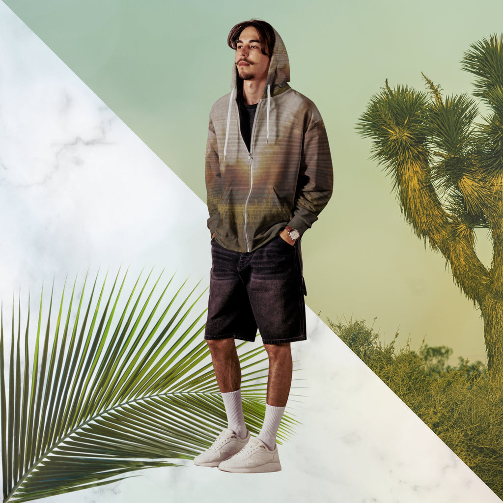 Multicolored all over print zip hoodie with full color 90s photo of sun setting through trees with grass in foreground overlayed with retro tv distortion and scan lines with grainy vhs effect transparent whit bars graphic in rhombus shape on left sleeve the numbers 1996 on right sleeve and left side of hood in retro 90s memphis font and retro jazz squiggle on back blending with colors