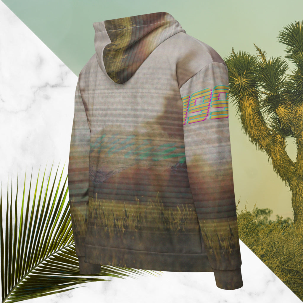 Multicolored all over print zip hoodie with full color 90s photo of sun setting through trees with grass in foreground overlayed with retro tv distortion and scan lines with grainy vhs effect transparent whit bars graphic in rhombus shape on left sleeve the numbers 1996 on right sleeve and left side of hood in retro 90s memphis font and retro jazz squiggle on back blending with colors