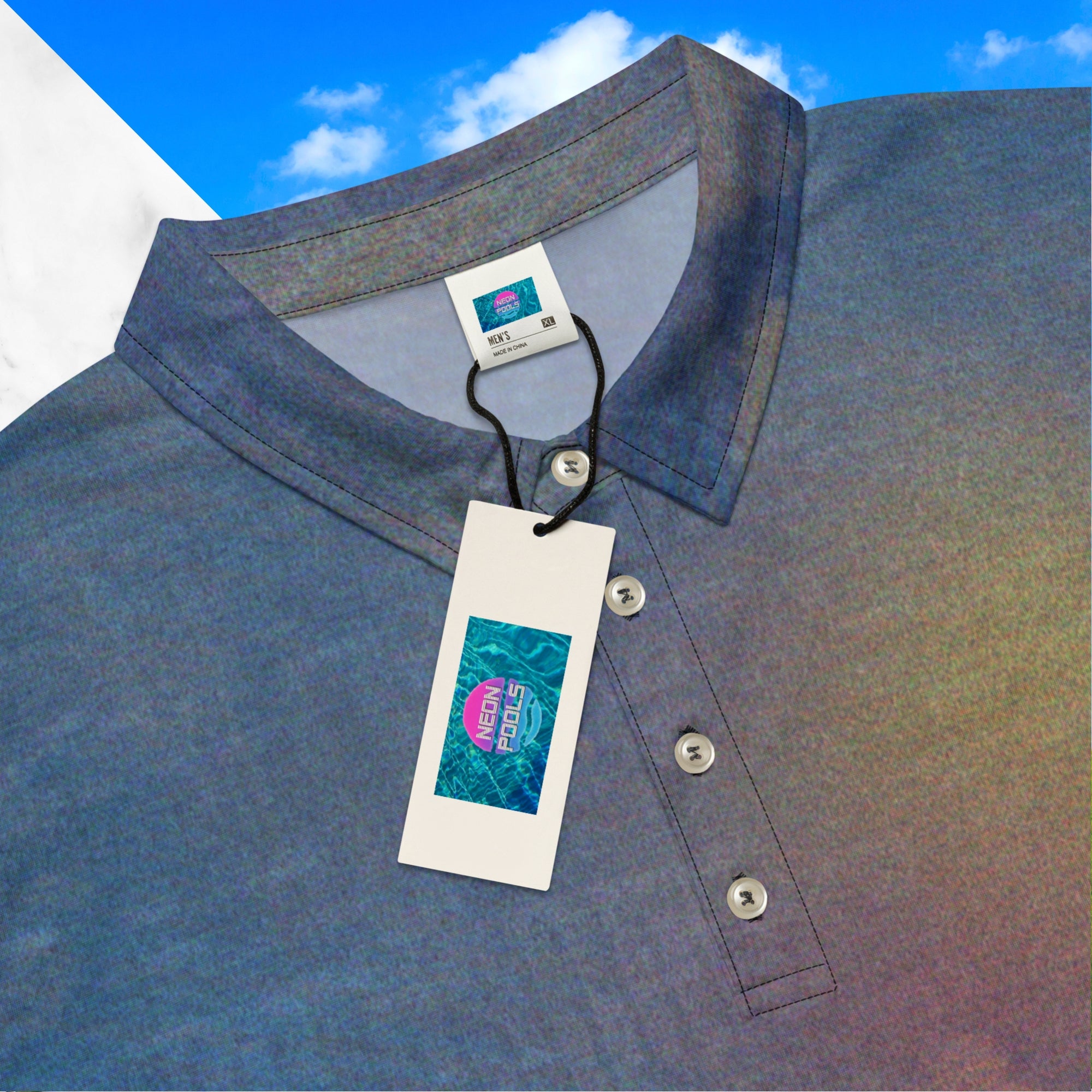 Closeup of inner label tag and Neon Pools logo and insignia on all over print frutiger aero themed blue sky clouds and grass polo shirt with retro digital effects tv distortion blue sky and white clouds with green grass at bottom abstract yellow and orange sun at left chest