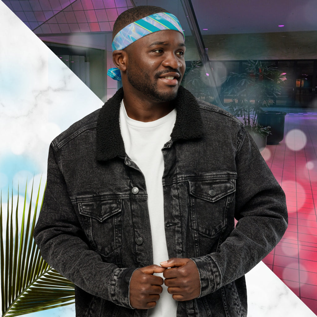 Full color all over print track jacket depicting blue water reflecting the colors of the sunset in oranges and pinks intensifying towards the top overlayed with a transparent thin white grid with tropical plant silhouettes of tropical plants creating stripe effects on sleeves with Neon Pools vaporwave sun emblem on left chest area