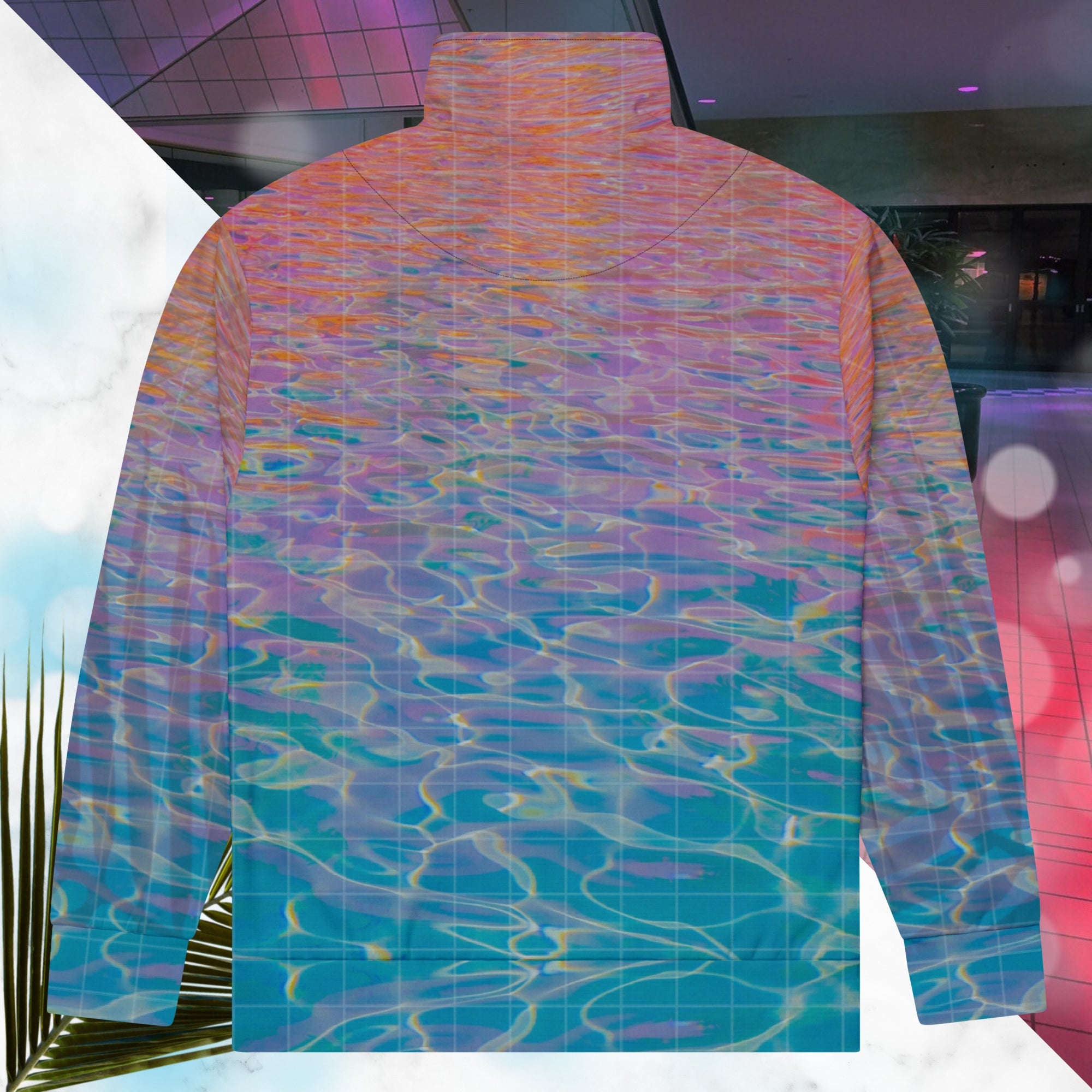 Multicolored all over print track jacket depicting blue water reflecting the colors of the sunset in oranges and pinks intensifying towards the top overlayed with a transparent thin white grid with tropical plant silhouettes of tropical plants creating stripe effects on sleeves with Neon Pools vaporwave sun emblem on left chest area
