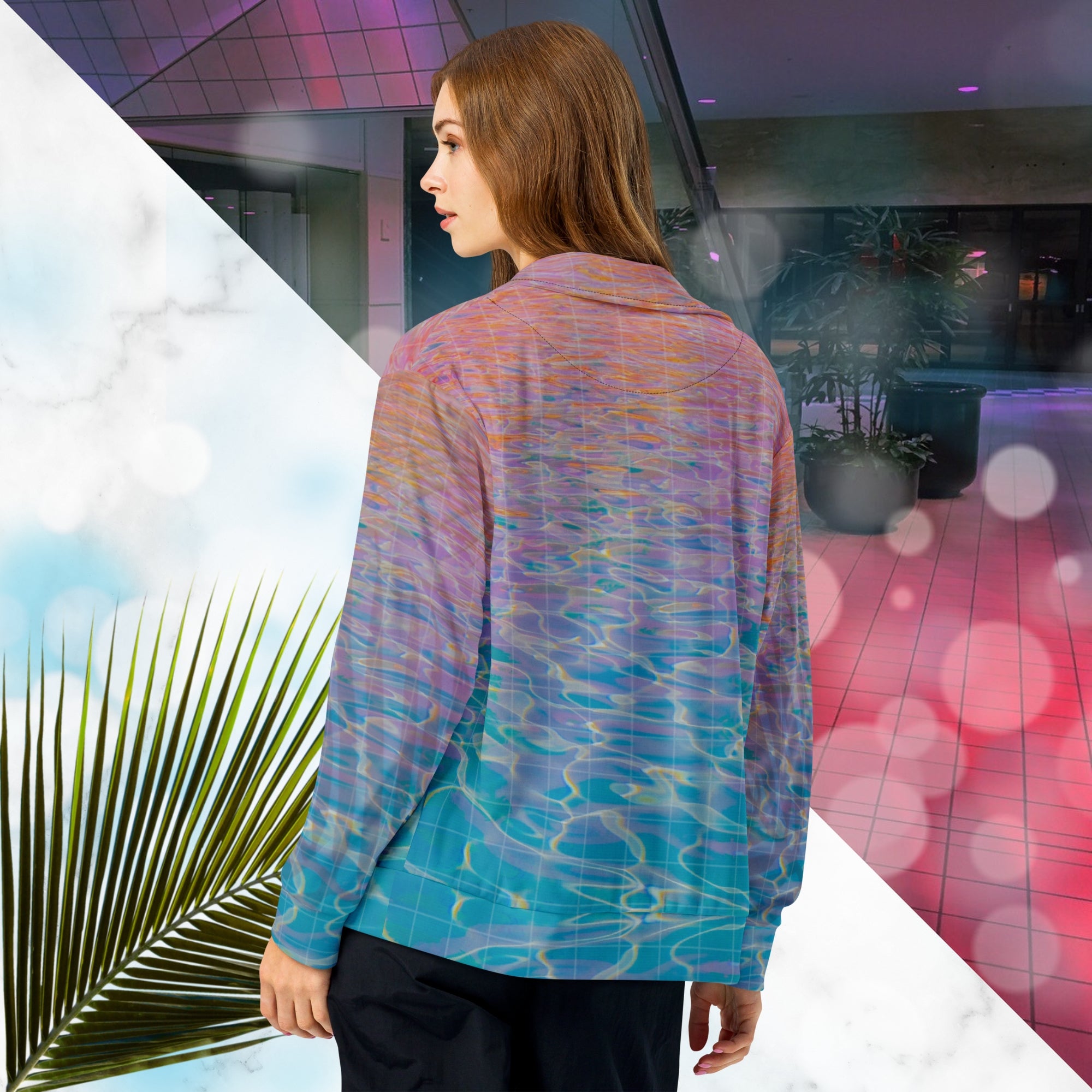 Multicolored all over print track jacket depicting blue water reflecting the colors of the sunset in oranges and pinks intensifying towards the top overlayed with a transparent thin white grid with tropical plant silhouettes of tropical plants creating stripe effects on sleeves with Neon Pools vaporwave sun emblem on left chest area