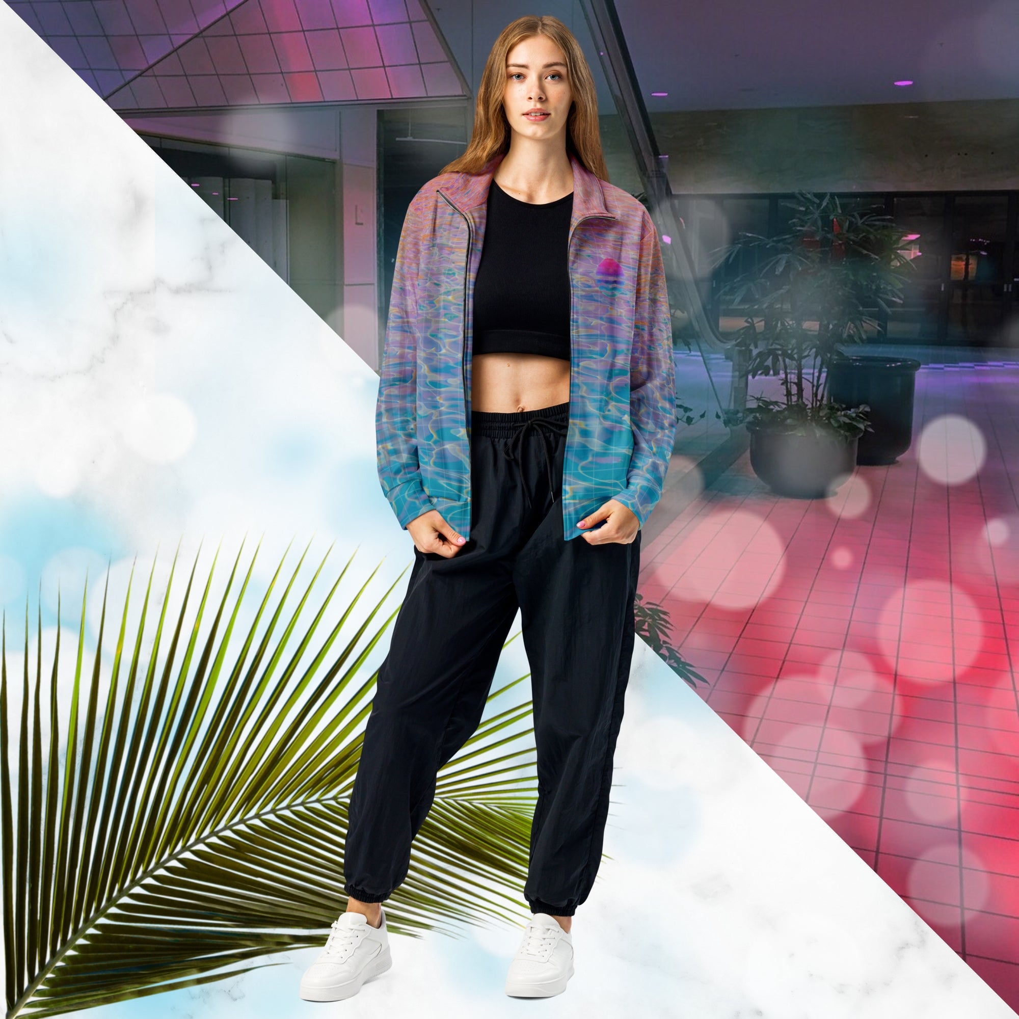 Multicolored all over print track jacket depicting blue water reflecting the colors of the sunset in oranges and pinks intensifying towards the top overlayed with a transparent thin white grid with tropical plant silhouettes of tropical plants creating stripe effects on sleeves with Neon Pools vaporwave sun emblem on left chest area