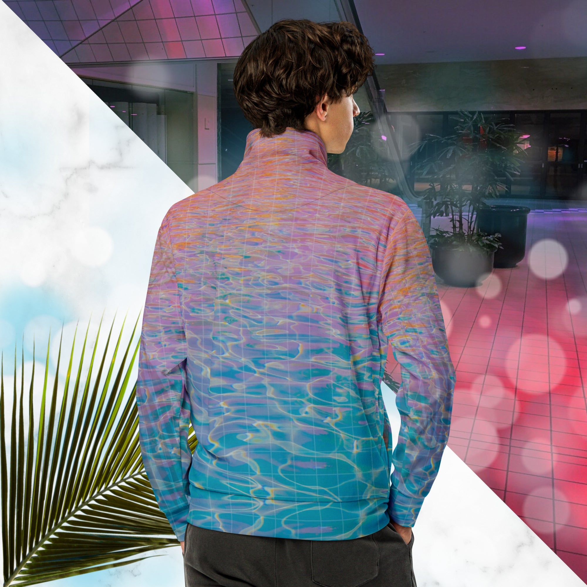 Multicolored all over print track jacket depicting blue water reflecting the colors of the sunset in oranges and pinks intensifying towards the top overlayed with a transparent thin white grid with tropical plant silhouettes of tropical plants creating stripe effects on sleeves with Neon Pools vaporwave sun emblem on left chest area