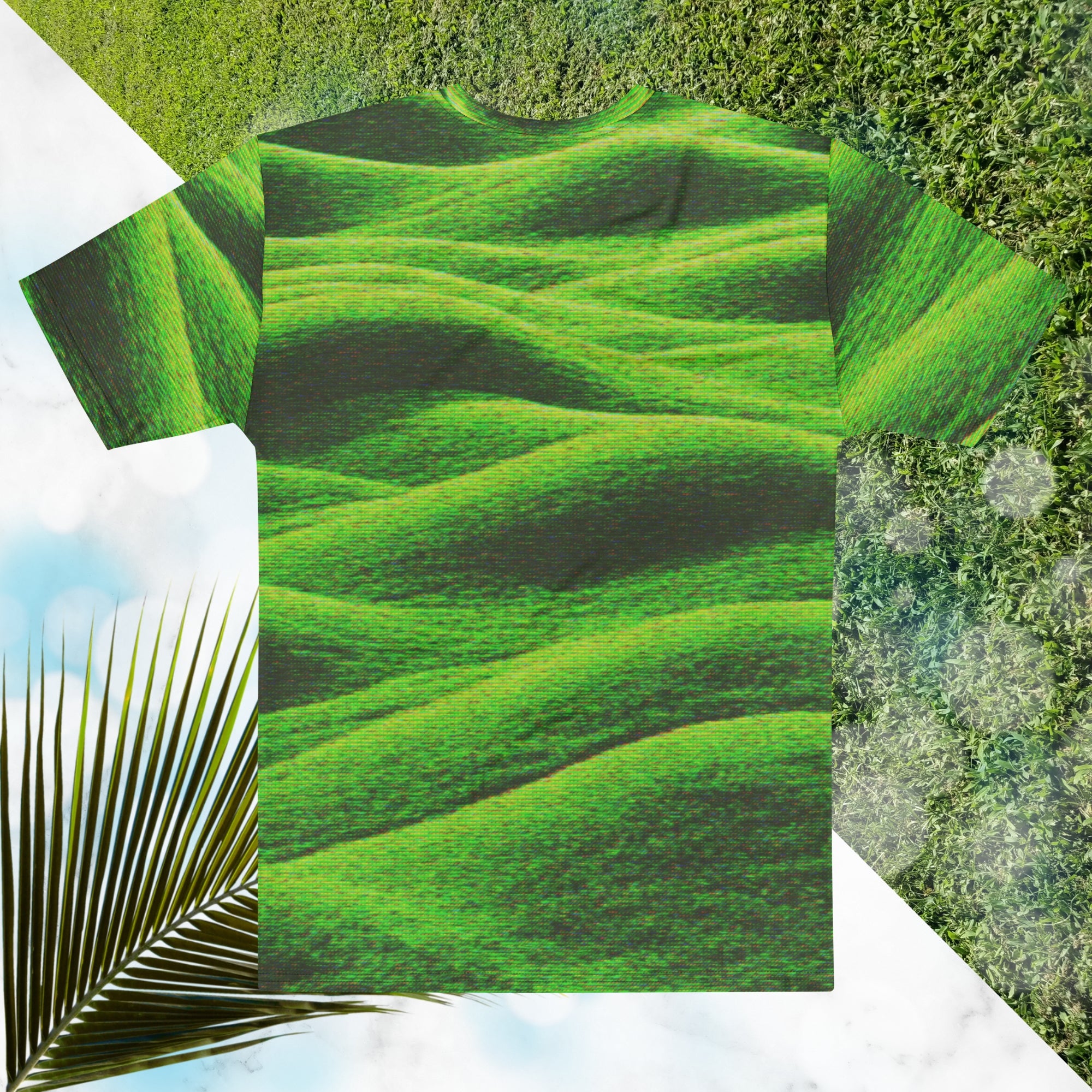 Green and black all over print graphic t-shirt depicting grass covered green rolling hills and their shadows overlayed with detailed v h s and retro t v distortion 
