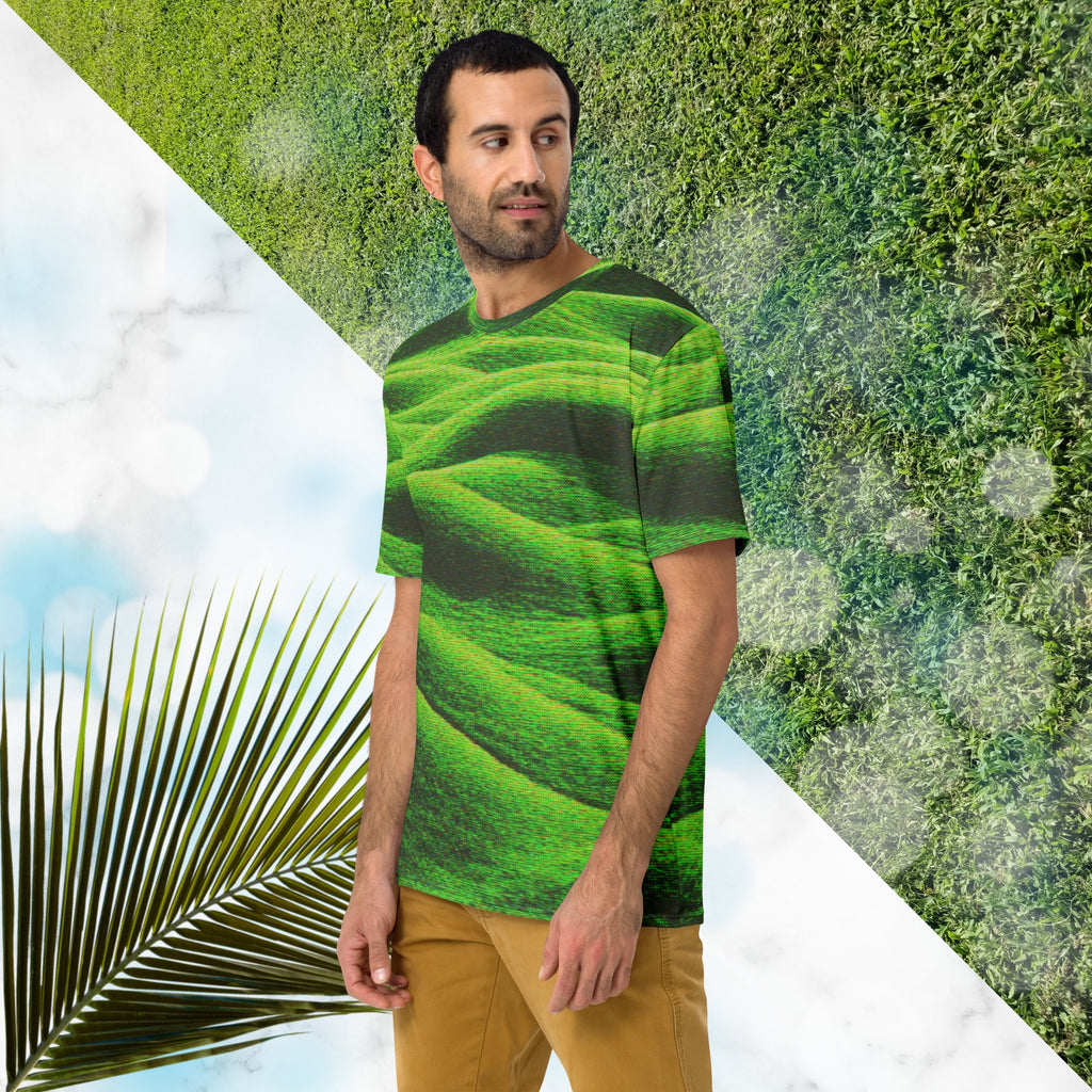 Green and black all over print graphic t-shirt depicting grass covered green rolling hills and their shadows overlayed with detailed v h s and retro t v distortion 