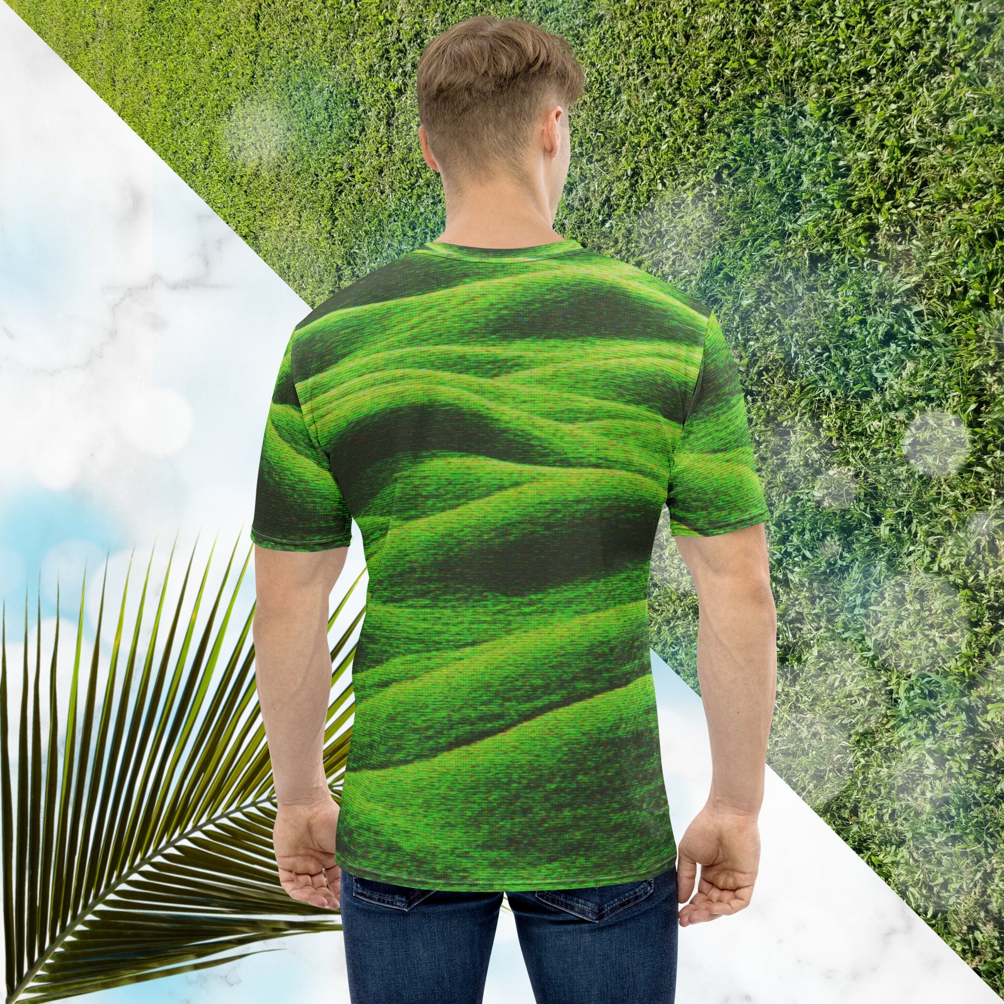 Green and black all over print graphic t-shirt depicting grass covered green rolling hills and their shadows overlayed with detailed v h s and retro t v distortion 