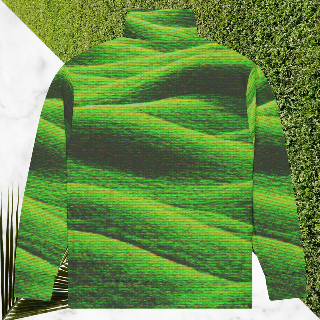 Primarily green and black full color all over print track jacket depicting grass covered green rolling hills and their shadows overlayed with detailed v h s and retro t v distortion with a green and blue Neon Pools vaporwave sun and waves emblem on the left chest