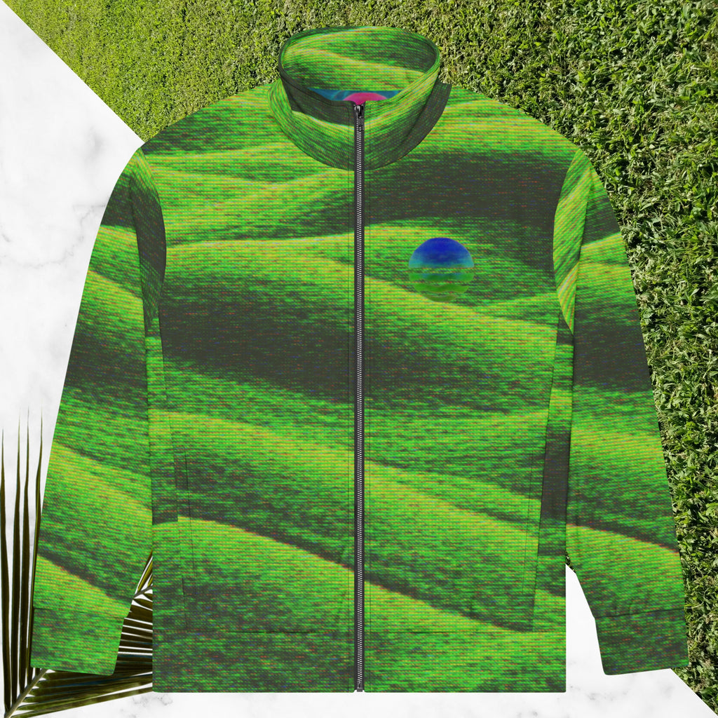 Primarily green and black full color all over print track jacket depicting grass covered green rolling hills and their shadows overlayed with detailed v h s and retro t v distortion with a green and blue Neon Pools vaporwave sun and waves emblem on the left chest