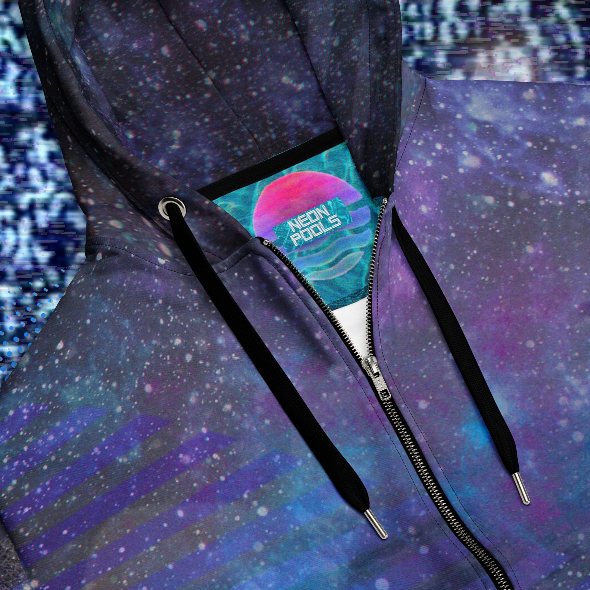 Closeup of neck line and Neon Pools logo insignia on multicolored all over print zip hoodie depicting galaxies nebula and stars with turquoise blue and purple space clouds transparent white diagonal and horizontal bars on sleeves a grade of purple bars on front and back with detailed v h s distortion and scanlines