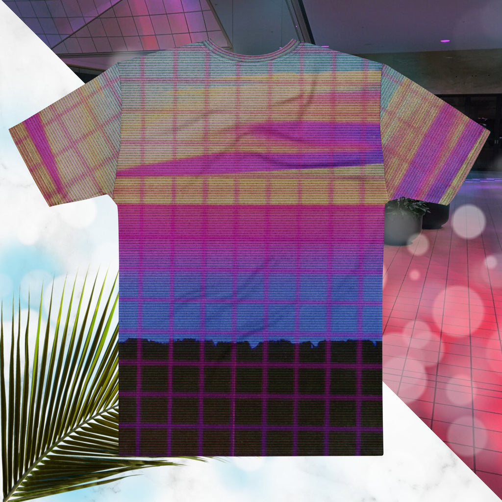 Multicolored all over print graphic t-shirt depicting a retro style grainy c g i image of a pink orange and yellow sunset with visible blue sky at the top sunset over pink to blue gradient water with a foreground of a black rocky cliff overlayed with a pink blurry grid and detailed v h s scanlines and distortion and a neon pools retro zigzag
