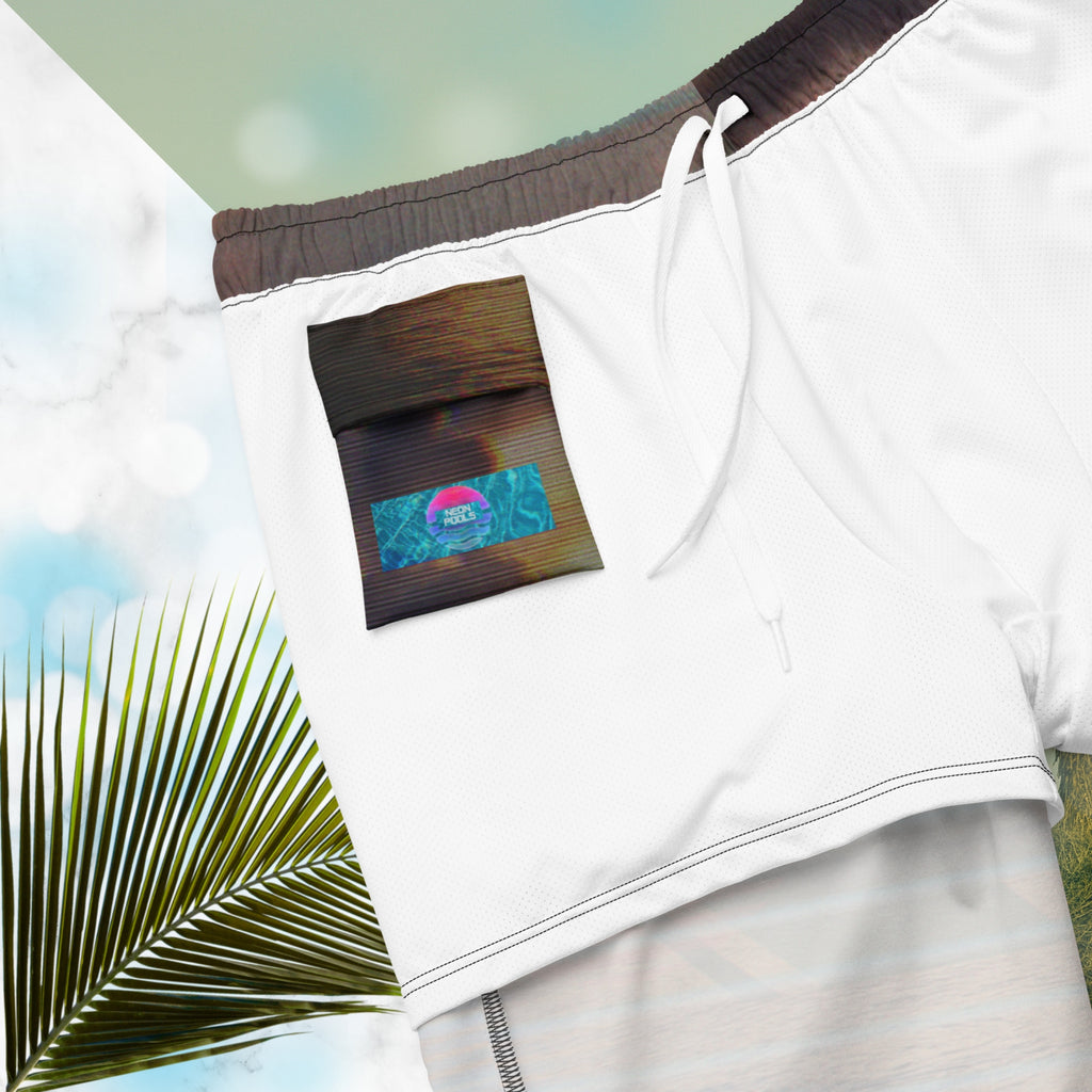 Closup of Neon Pools logo and insignia on inner pocket and inner liner on full color all over print swim trunks with retro ocean sunset with shimmering water photo overlayed with transparent stripes and graphic shapes in a 1980s memphis design style partial stripes and a transparent vaporwave broken sun in coral tone with detailed vhs distortion effects