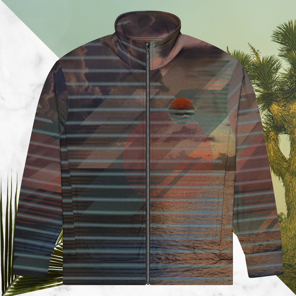 Full color all over print track jacket with retro ocean sunset with shimmering water photo overlayed with transparent stripes and graphic shapes in a 1980s memphis design style partial stripes and a transparent vaporwave broken sun in coral tone neon pools broken sun and waves logo emblem at left chest