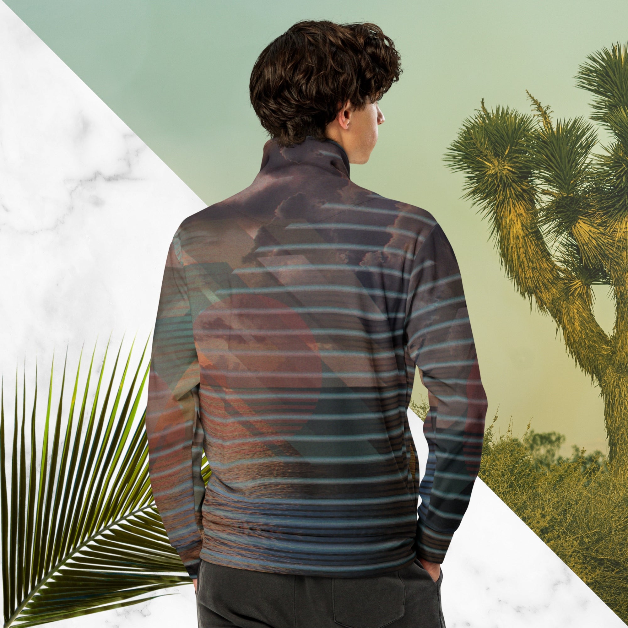 Full color all over print track jacket with retro ocean sunset with shimmering water photo overlayed with transparent stripes and graphic shapes in a 1980s memphis design style partial stripes and a transparent vaporwave broken sun in coral tone neon pools broken sun and waves logo emblem at left chest