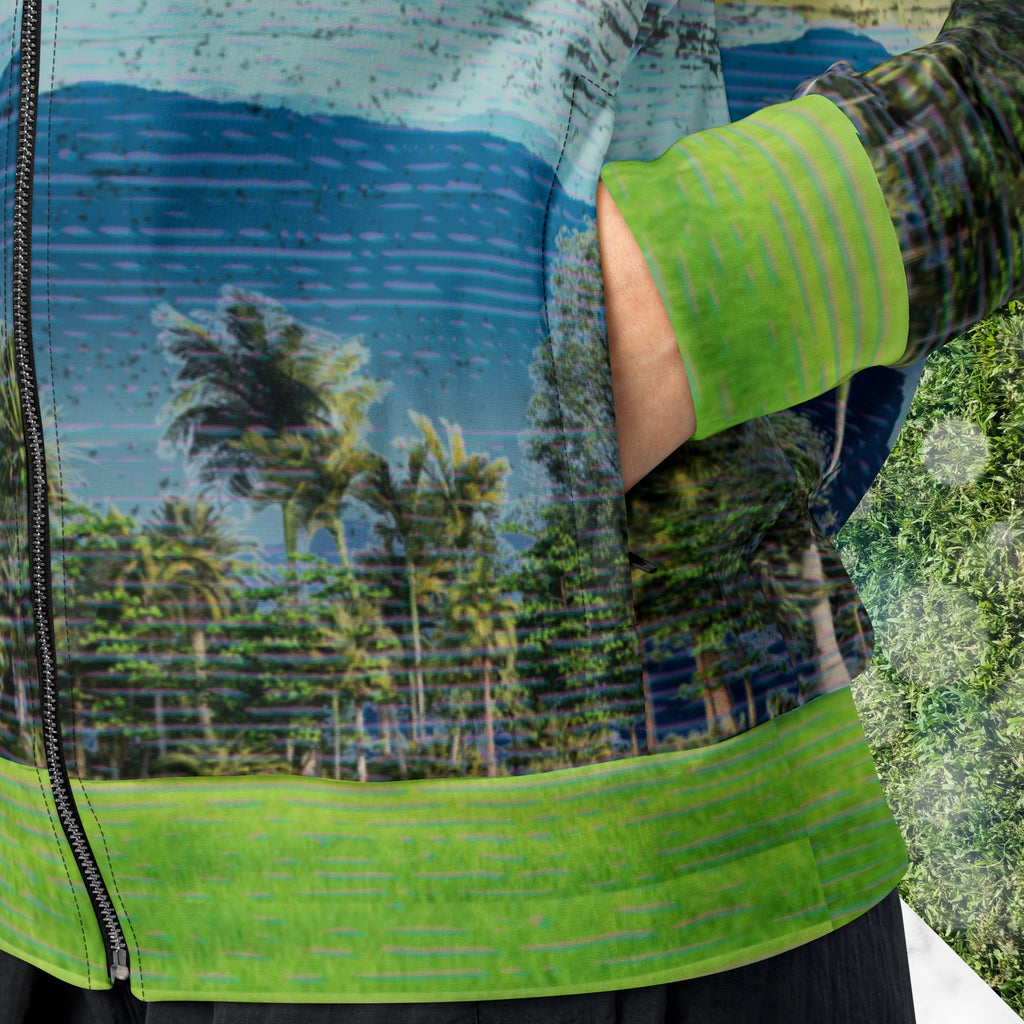 Closeup of pocket on colorful vaporwave and memphis design inspired all over print track jacket depicting a foreground of grass and palm trees with a backdrop of mountains more mountains and a sky filled with retro neon orange to yellow cascading bold zigzags and a vaporwave broken sun on the back with lots of clouds various bars and geometric shapes on the sleeves with Neon Pools magenta and blue vaporwave sun and waves logo at left chest