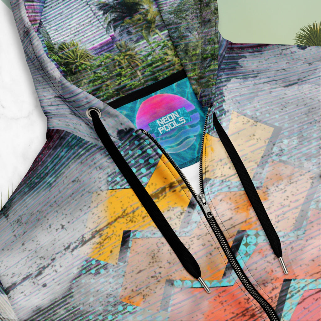 Closeup of neckline and neon pools inner logo and insignia on colorful vaporwave and memphis design inspired all over print zip hoodie depicting a foreground of grass and palm trees with a backdrop of mountains more mountains and a sky filled with retro neon orange to yellow cascading bold zigzags and a vaporwave broken sun on the back with lots of clouds various bars and geometric shapes on the sleeves