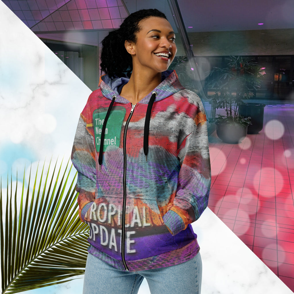 Vibrant multicolored all over print zip hoodie with retro tv weather broadcast graphics featuring a logo that says The Neon Channel and the words tropical update teal and purple retro zigzag tropical sunset in brilliant oranges and reds with clouds 90s distortion blue dots graphics