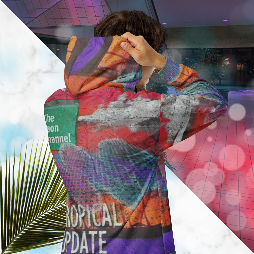 Vibrant multicolored all over print zip hoodie with retro tv weather broadcast graphics featuring a logo that says The Neon Channel and the words tropical update teal and purple retro zigzag tropical sunset in brilliant oranges and reds with clouds 90s distortion blue dots graphics