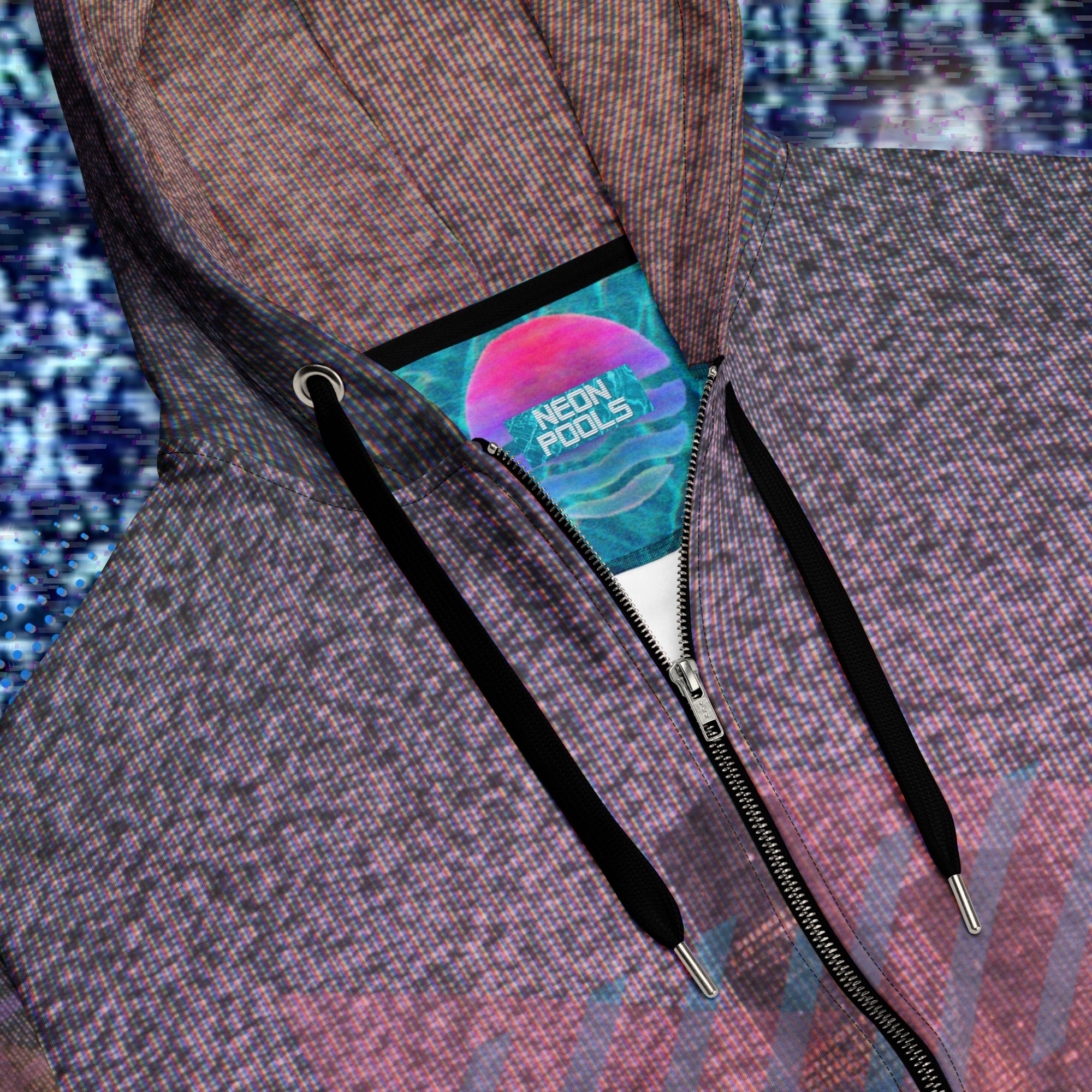 Closeup of necline and insignia on zip hoodie with background of TV static the front has city skyline at night with foreground of palm trees overlayed with bold transparent teal slashes and coral pink right facing triangles in memphis design style pattern right sleeve has 4 bold diagonal bands of orange fading to purple overlayed with a pink grid left sleeve is coral pink shapes and teal bars with the Neon Pools squiggle design the back has a 3d pink grid and two overlapping broken suns and vertical slashes