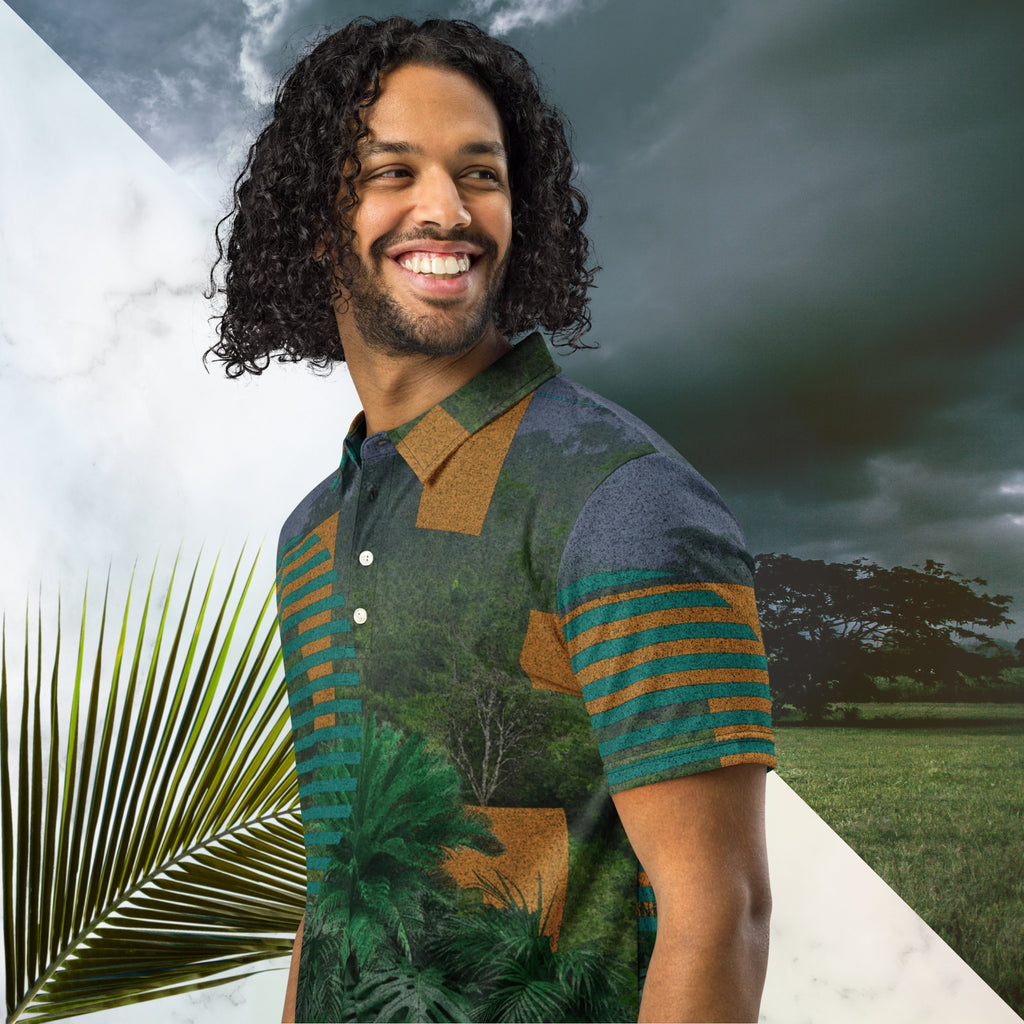Primarily green orange teal and misty blue shirt depicting a dense lush misty jungle overlayed and interlaced with 3d ferns monstera plants and bold solid orange abstract graphic shapes bold teal rounded modern stripes and a dark gray stormy sky at the top overlayed with retro inspired static similar to video degradation on an old tv set