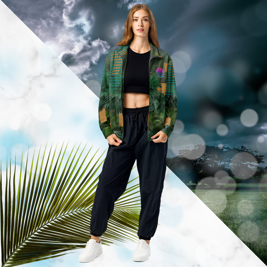 Multicolored all over print track jacket depicting a dense lush jungle overlayed and interlaced with bold solid orange abstract graphics teal rounded modern stripes and a dark gray stormy sky at the top overlayed with retro inspired static similar to video degradation on an old television set with a Neon Pools magenta and blue vaporwave sun and waves emblem at left chest