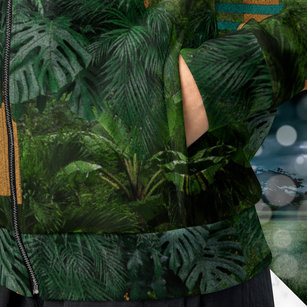 Closeup of pocket on multicolored all over print track jacket depicting a dense lush jungle overlayed and interlaced with bold solid orange abstract graphics teal rounded modern stripes and a dark gray stormy sky at the top overlayed with retro inspired static similar to video degradation on an old television set with a Neon Pools magenta and blue vaporwave sun and waves emblem at left chest